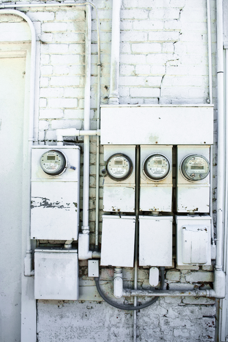 four electric meter boxes