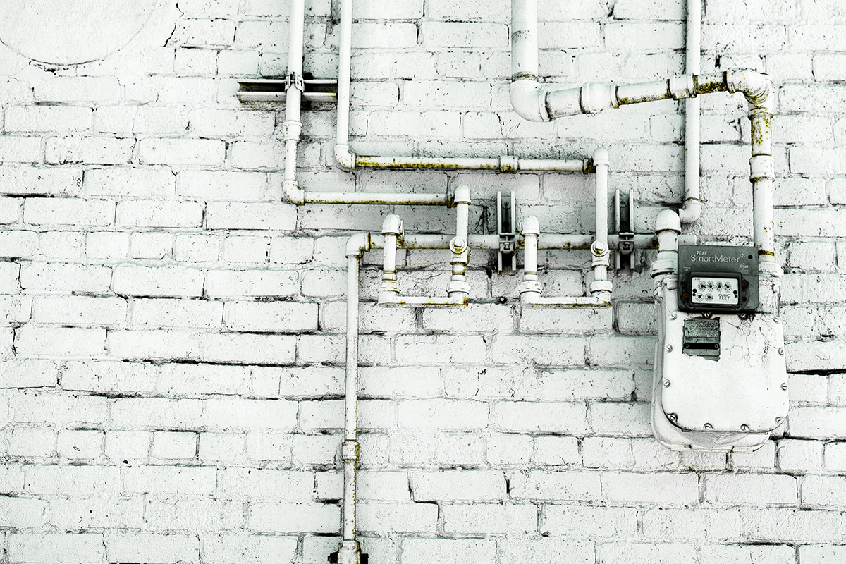 pipes and utilities on white brick wall, Casper, Wyoming